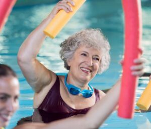 senior woman doing water aerobics